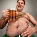 Portrait of funny fat man with glass of beer